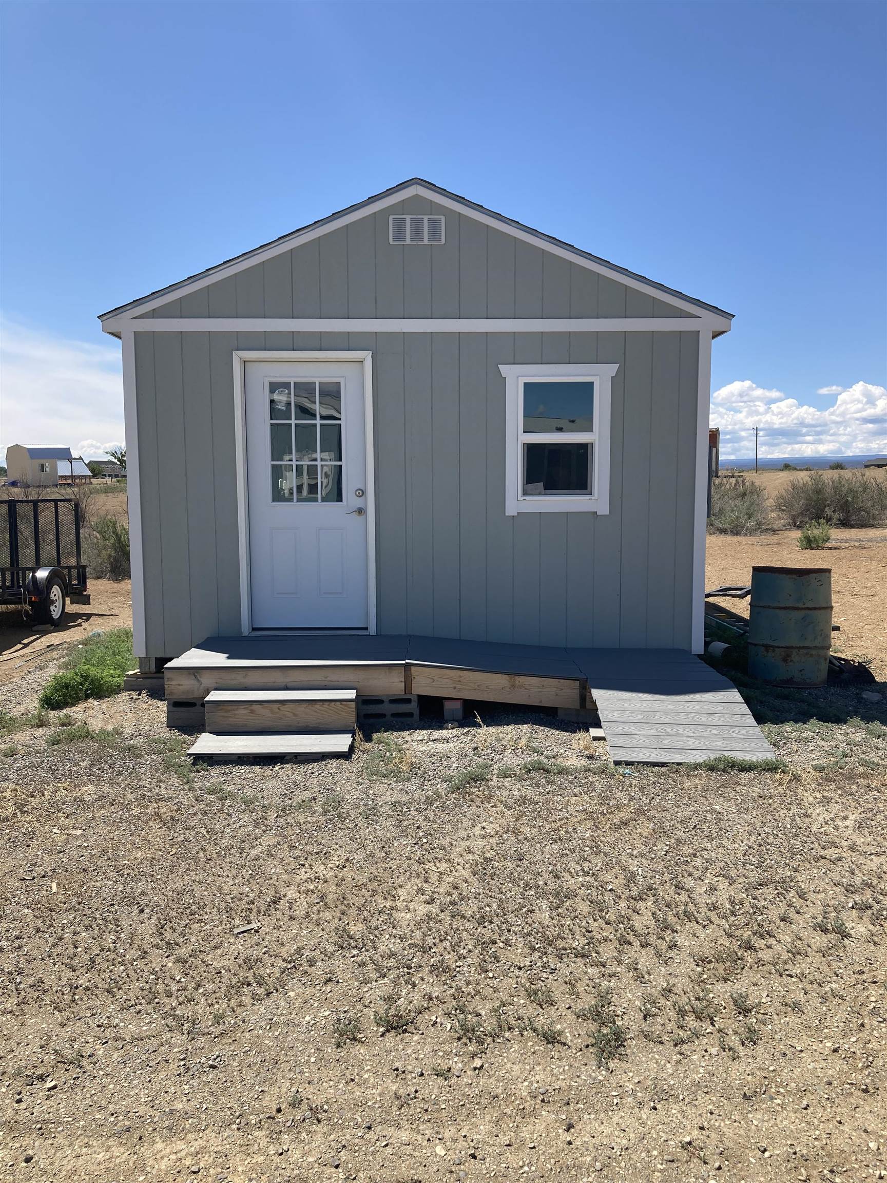 2413 1300th Road Delta, CO 81416 - Photo 24 of 35 a front view of a house with a yard