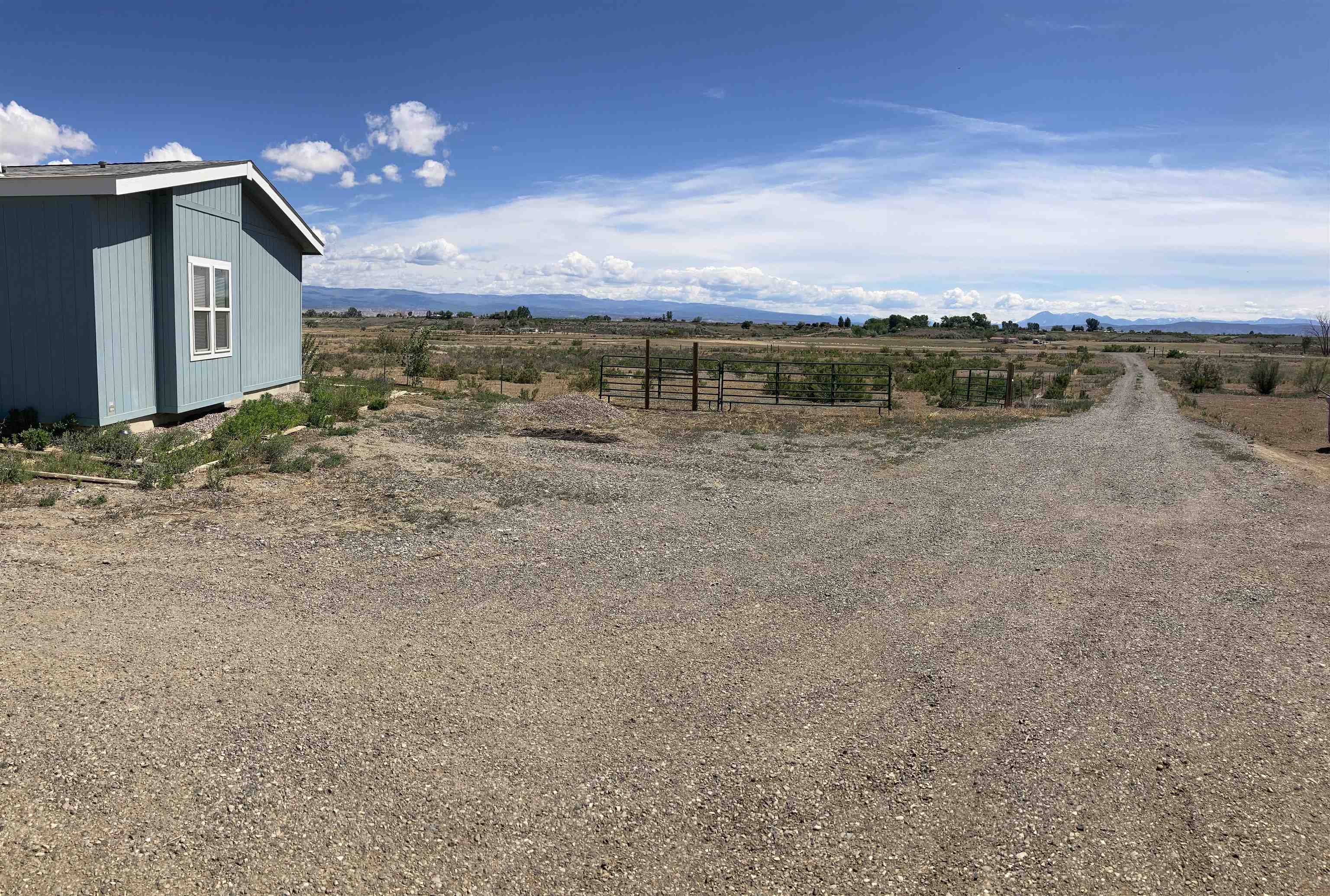 2413 1300th Road Delta, CO 81416 - Photo 31 of 35 a view of a house with a yard