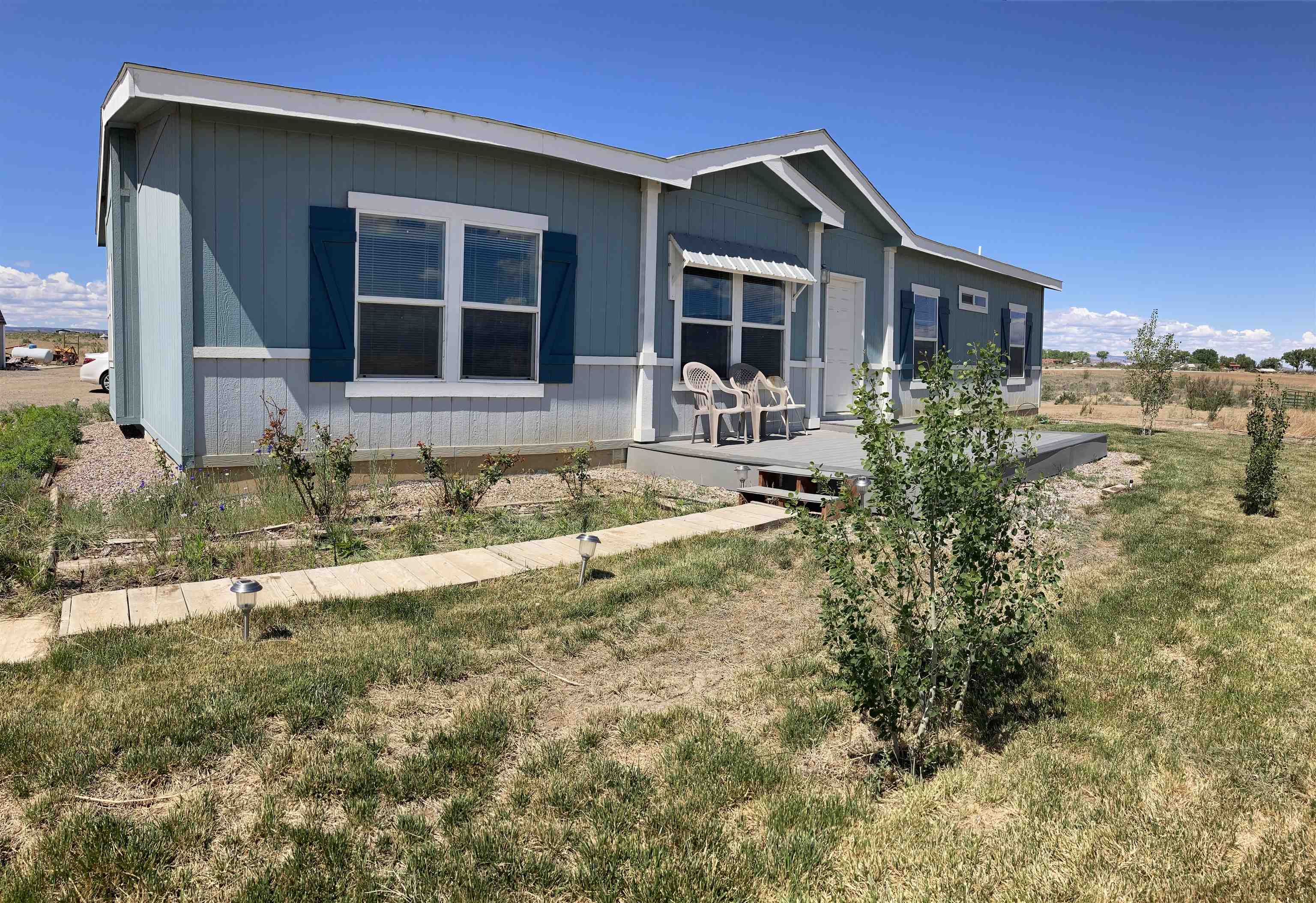 2413 1300th Road Delta, CO 81416 - Photo 35 of 35 a front view of a house with a yard