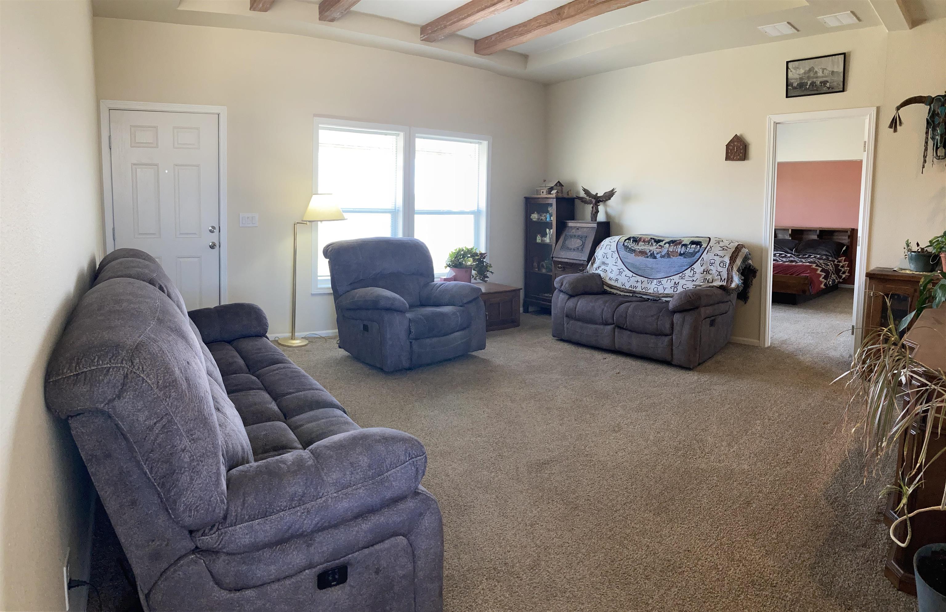 2413 1300th Road Delta, CO 81416 - Photo 6 of 35 a living room with furniture and a window