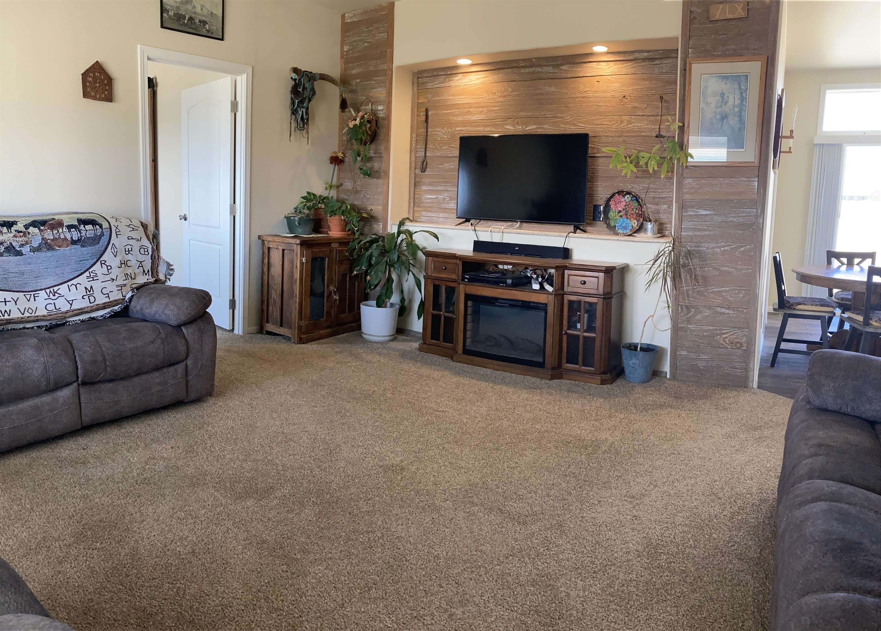 2413 1300th Road Delta, CO 81416 - Photo 7 of 35 a living room with furniture and a flat screen tv