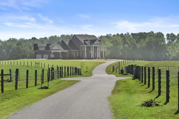 a view of a park with iron fence