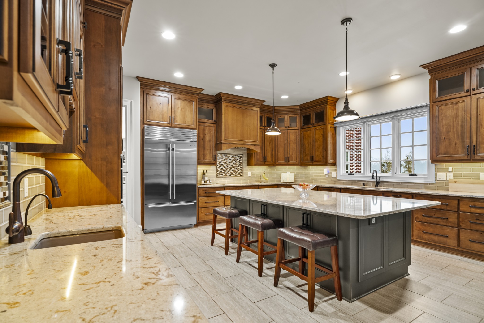 555 Williams Road Clarksville, TN 37043 - Photo 46 of 52 a large kitchen with kitchen island a sink and a refrigerator