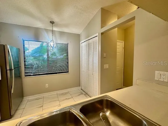 a room with a bed and a window