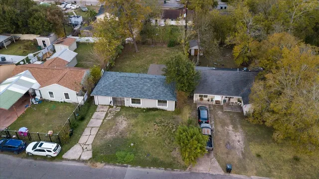 an aerial view of a house with a garden