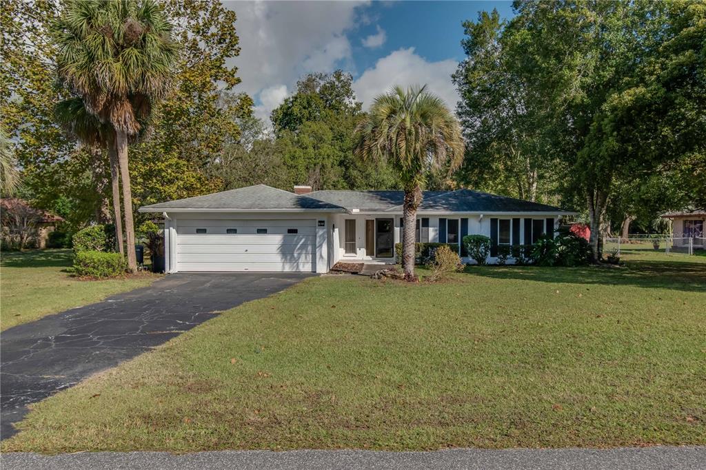 8161 Southwest 100th Street Road Ocala, FL 34481 - Photo 1 of 1 front view of a house with a yard