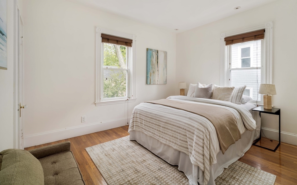 52 Walter Street Boston, MA 02131 - Photo 22 of 31 a bedroom with a bed and a window