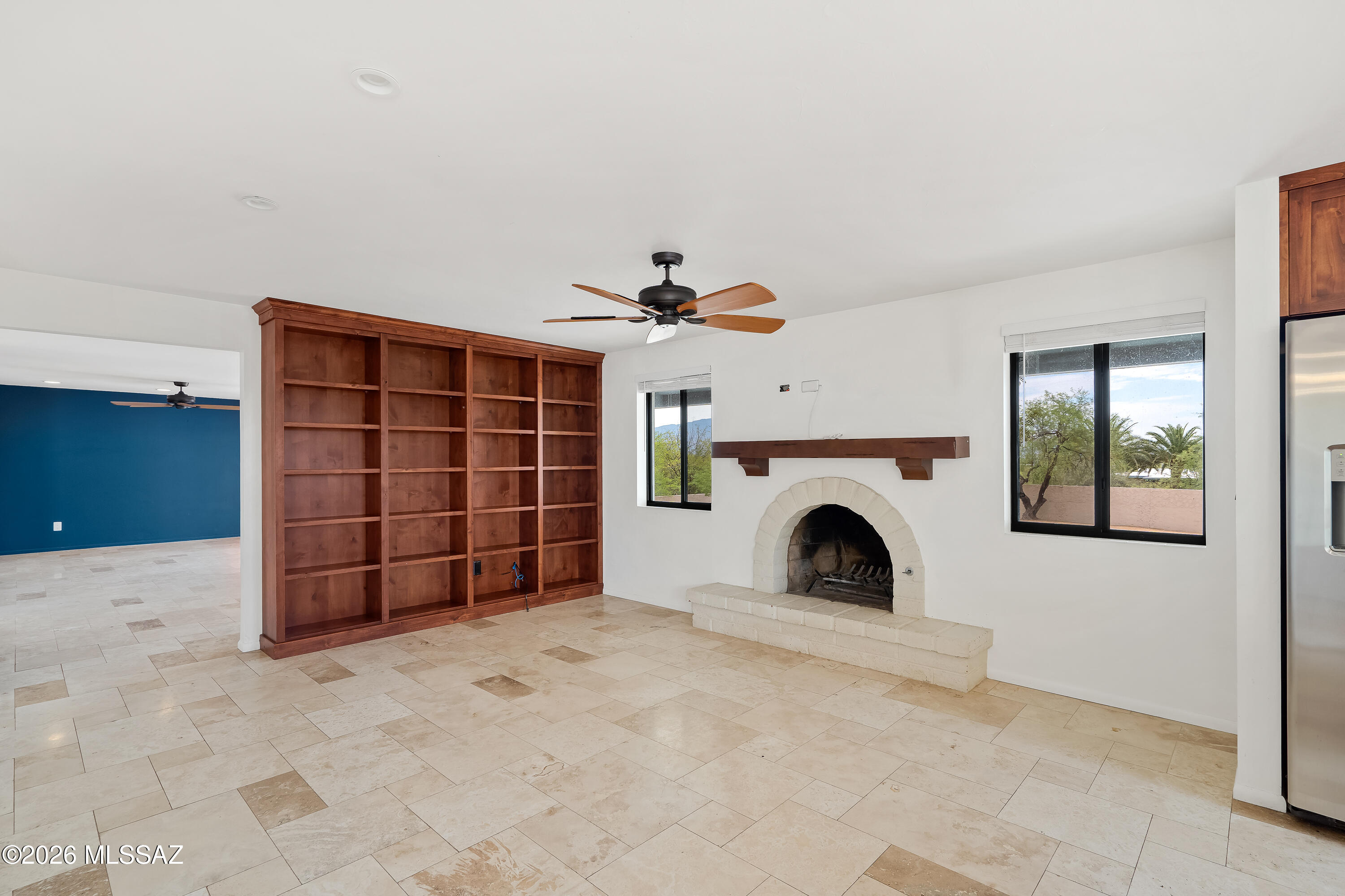 9420 East Ravine Trail Tucson, AZ 85749 - Photo 11 of 39 a view of a livingroom with an empty space and a fireplace