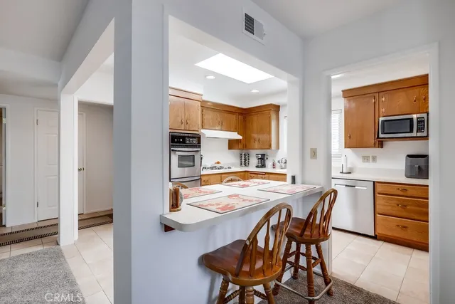 a kitchen with sink cabinets and window