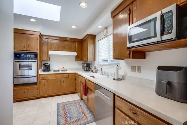 a living room with furniture a table and large window