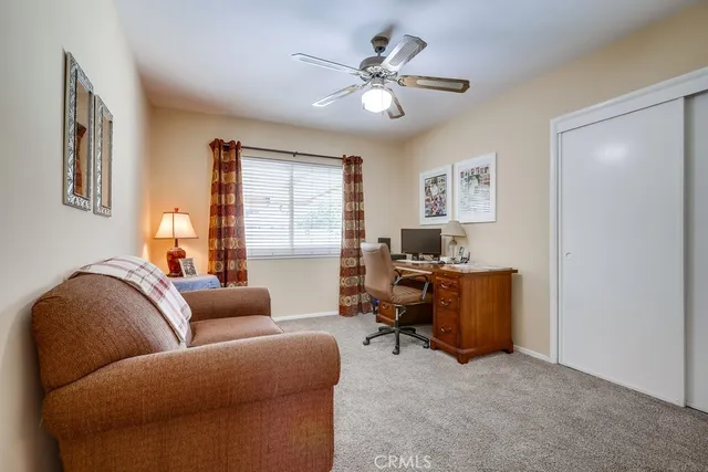 a bedroom with a bed and a television