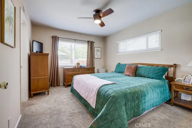 a bathroom with a granite countertop sink a mirror a shower and a shower
