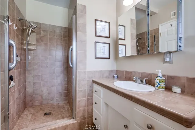 a bathroom with a shower and a tub