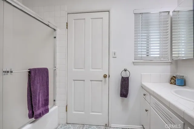 a room with table chairs and wooden floor