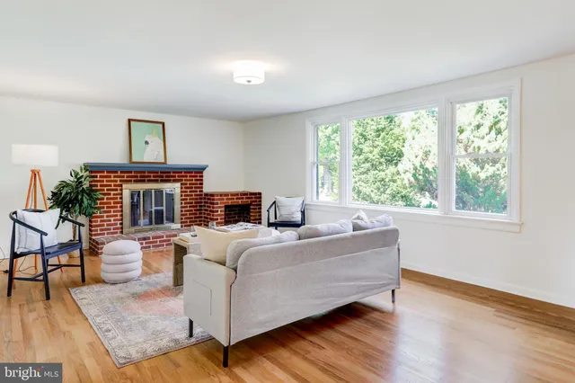 a bed room with furniture and a window