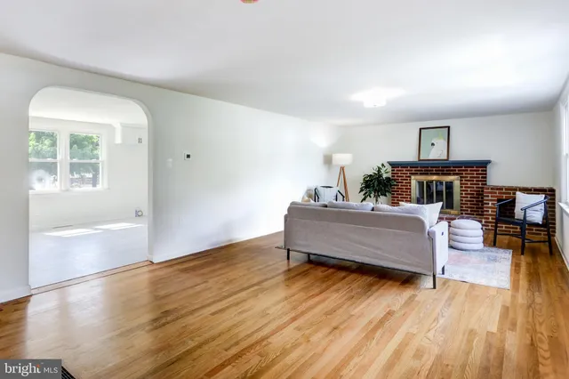 a bedroom with furniture and a wooden floor