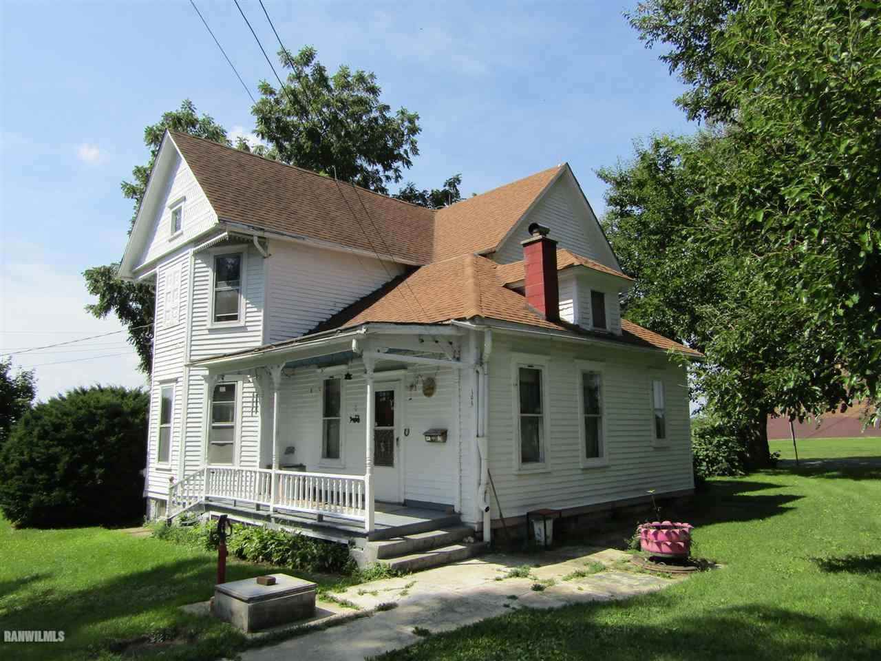 106 3rd Street East Ridott, IL 61067 - Photo 3 of 19 a front view of a house with a yard