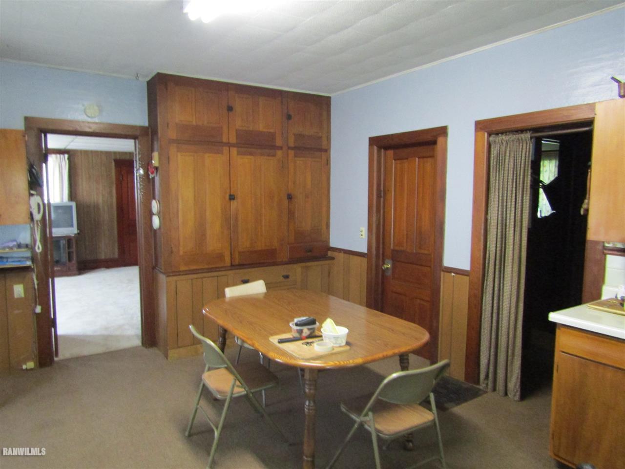 106 3rd Street East Ridott, IL 61067 - Photo 8 of 19 a view of a dining room with furniture and window