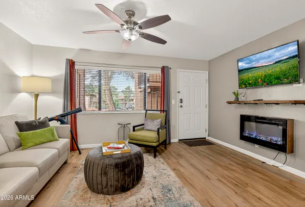 a living room with furniture and a fireplace