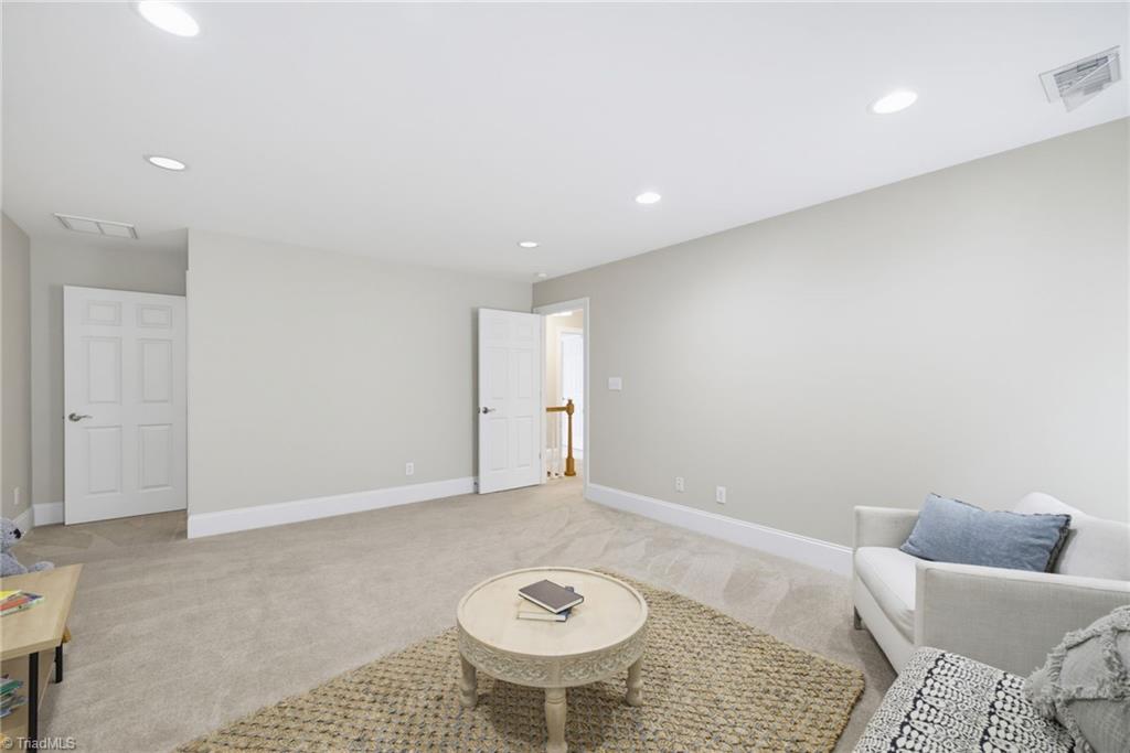 5411 Effieham Street Oak Ridge, NC 27310 - Photo 32 of 49 3rd level can be used for a home office, teen hangout, a craft room or a homeschool room-whatever your families needs are