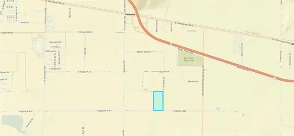 a view of a dry field in the middle of a field