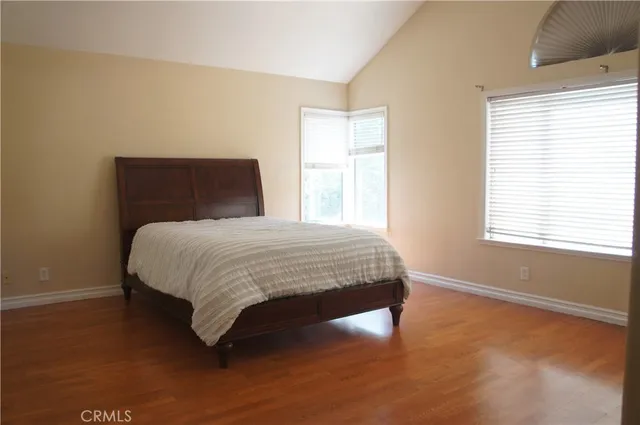 a bedroom with a bed and window
