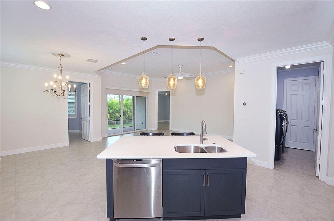 6145 Bella Rosa Lane Vero Beach, FL 32966 - Photo 11 of 36 a large bathroom with a sink a large mirror and shower