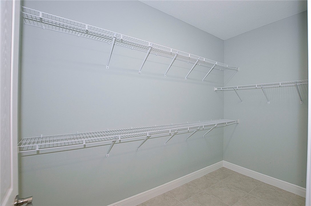 6145 Bella Rosa Lane Vero Beach, FL 32966 - Photo 16 of 36 a view of a room with racks on the wall