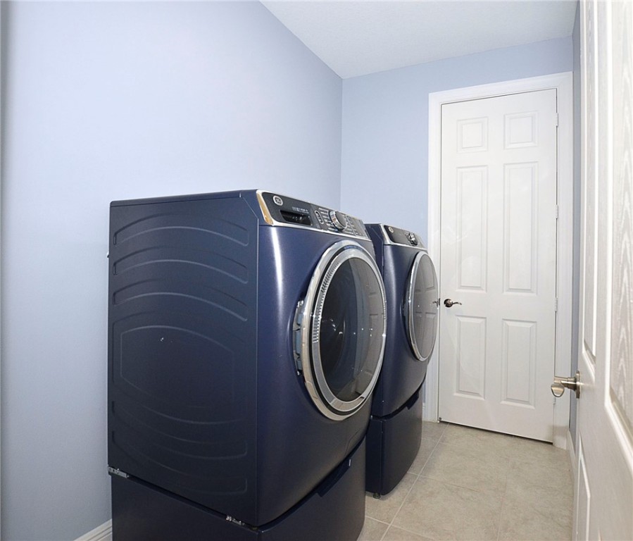 6145 Bella Rosa Lane Vero Beach, FL 32966 - Photo 25 of 36 a utility room with dryer and washer