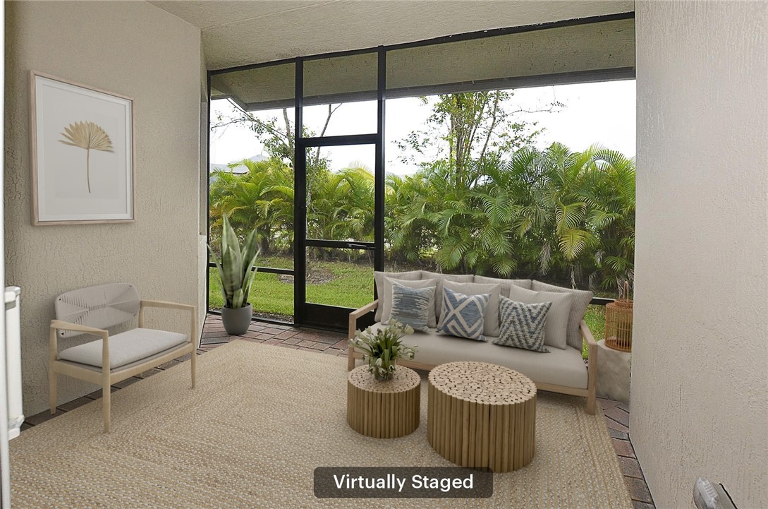 6145 Bella Rosa Lane Vero Beach, FL 32966 - Photo 26 of 36 a living room with furniture and a potted plant