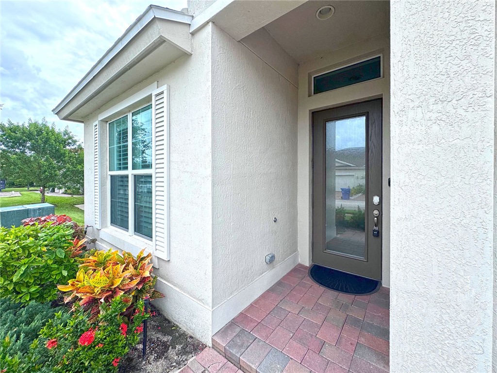6145 Bella Rosa Lane Vero Beach, FL 32966 - Photo 4 of 36 a view of a house with a balcony