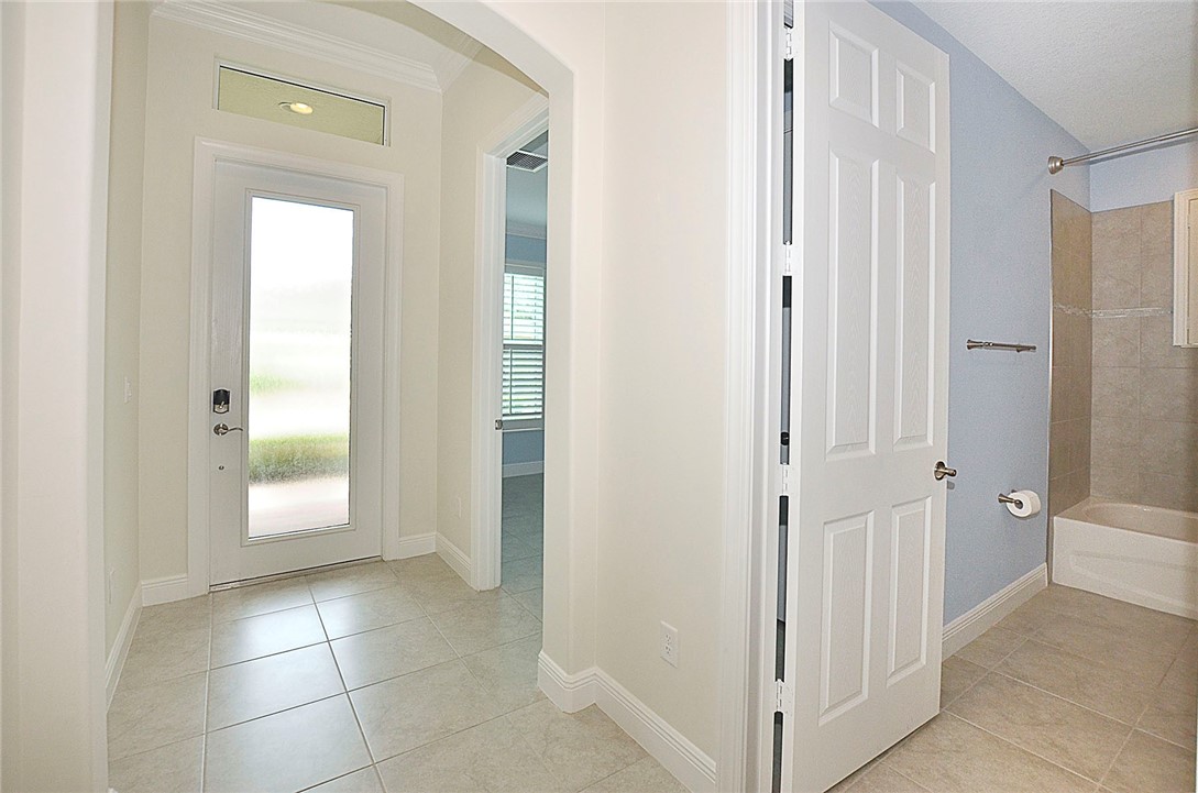 6145 Bella Rosa Lane Vero Beach, FL 32966 - Photo 5 of 36 a view of a hallway with closet and a bathroom