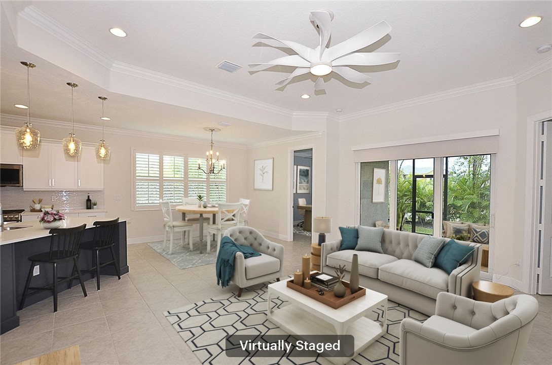 6145 Bella Rosa Lane Vero Beach, FL 32966 - Photo 6 of 36 a living room with furniture and a large window