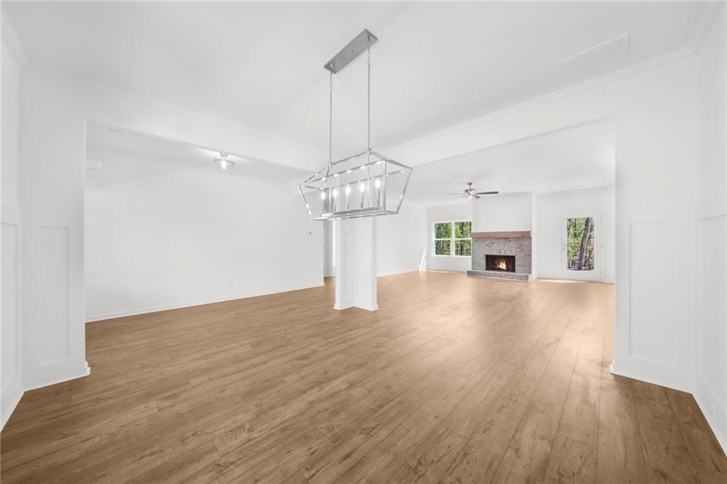 8915 Bethel Road Gainesville, GA 30506 - Photo 16 of 54 a view of a room with wooden floor fireplace and window