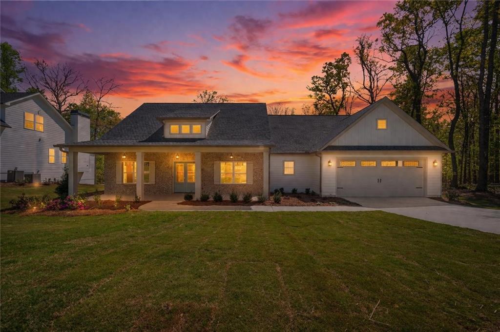 8915 Bethel Road Gainesville, GA 30506 - Photo 2 of 54 a view of a house with a yard