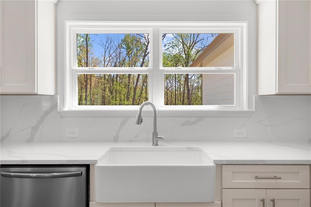 8915 Bethel Road Gainesville, GA 30506 - Photo 25 of 54 a bathroom with a sink and a window