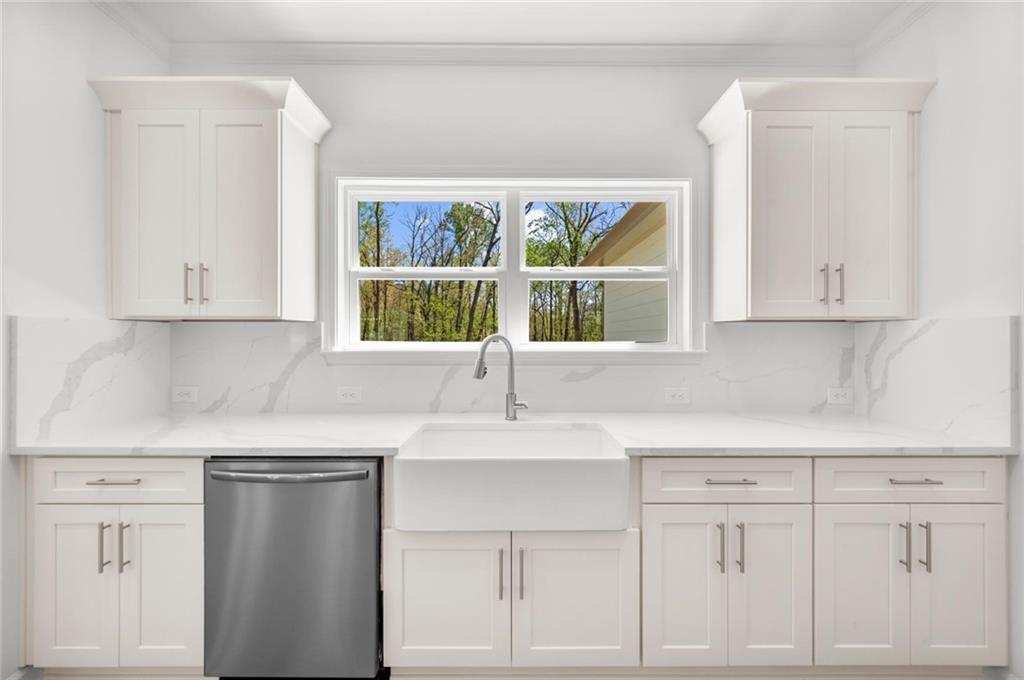 8915 Bethel Road Gainesville, GA 30506 - Photo 26 of 54 a kitchen with white cabinets and window
