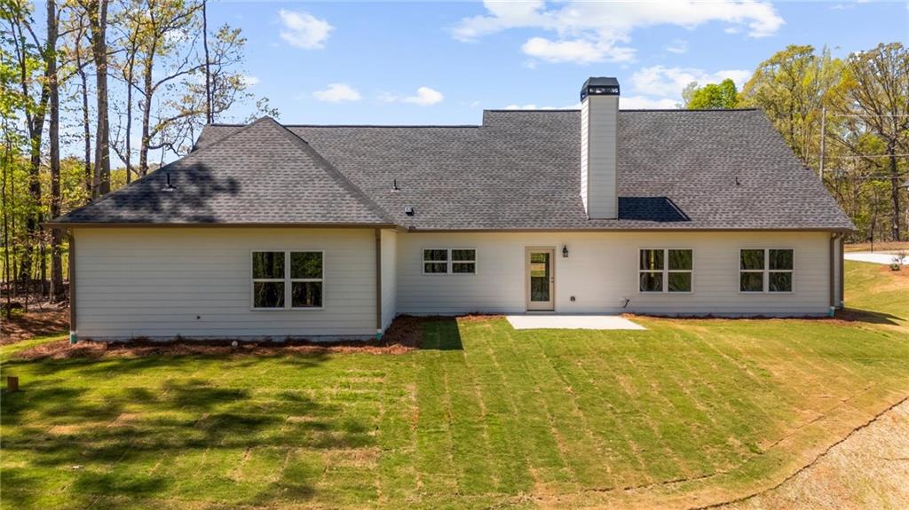 8915 Bethel Road Gainesville, GA 30506 - Photo 4 of 54 a house view with a garden space