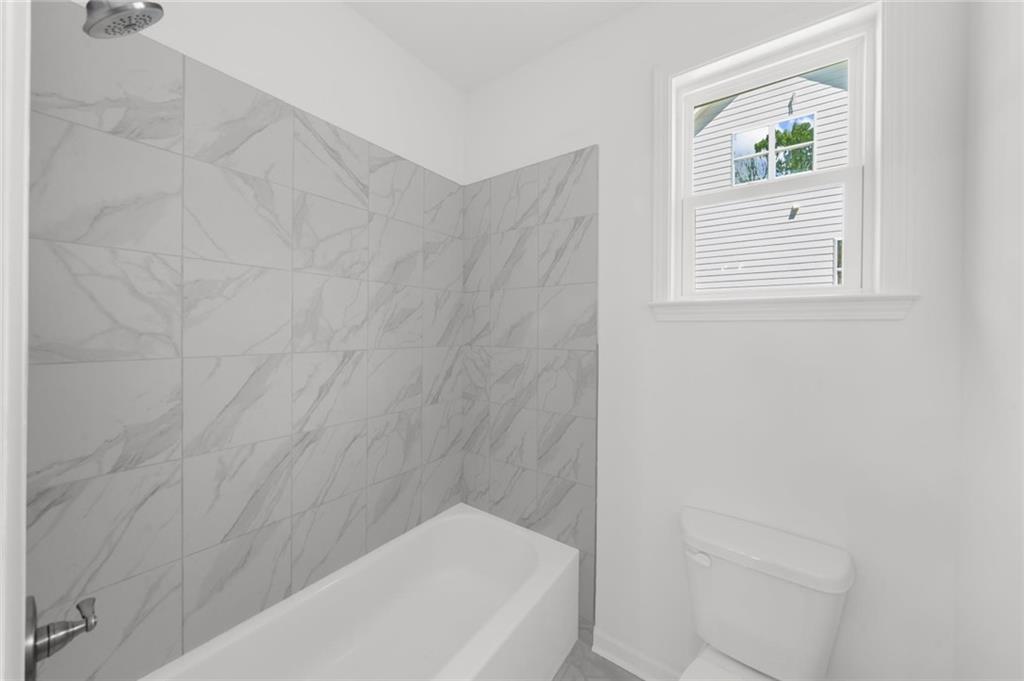 8915 Bethel Road Gainesville, GA 30506 - Photo 47 of 54 a bathroom with a bathtub