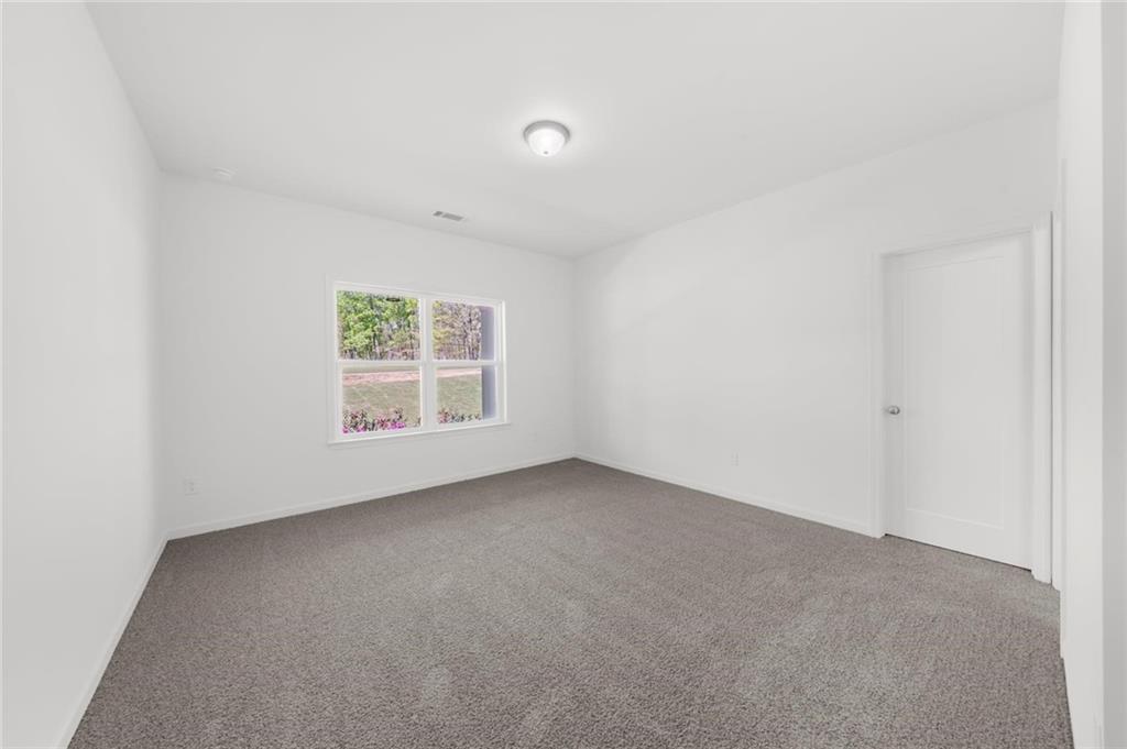 8915 Bethel Road Gainesville, GA 30506 - Photo 50 of 54 an empty room with windows