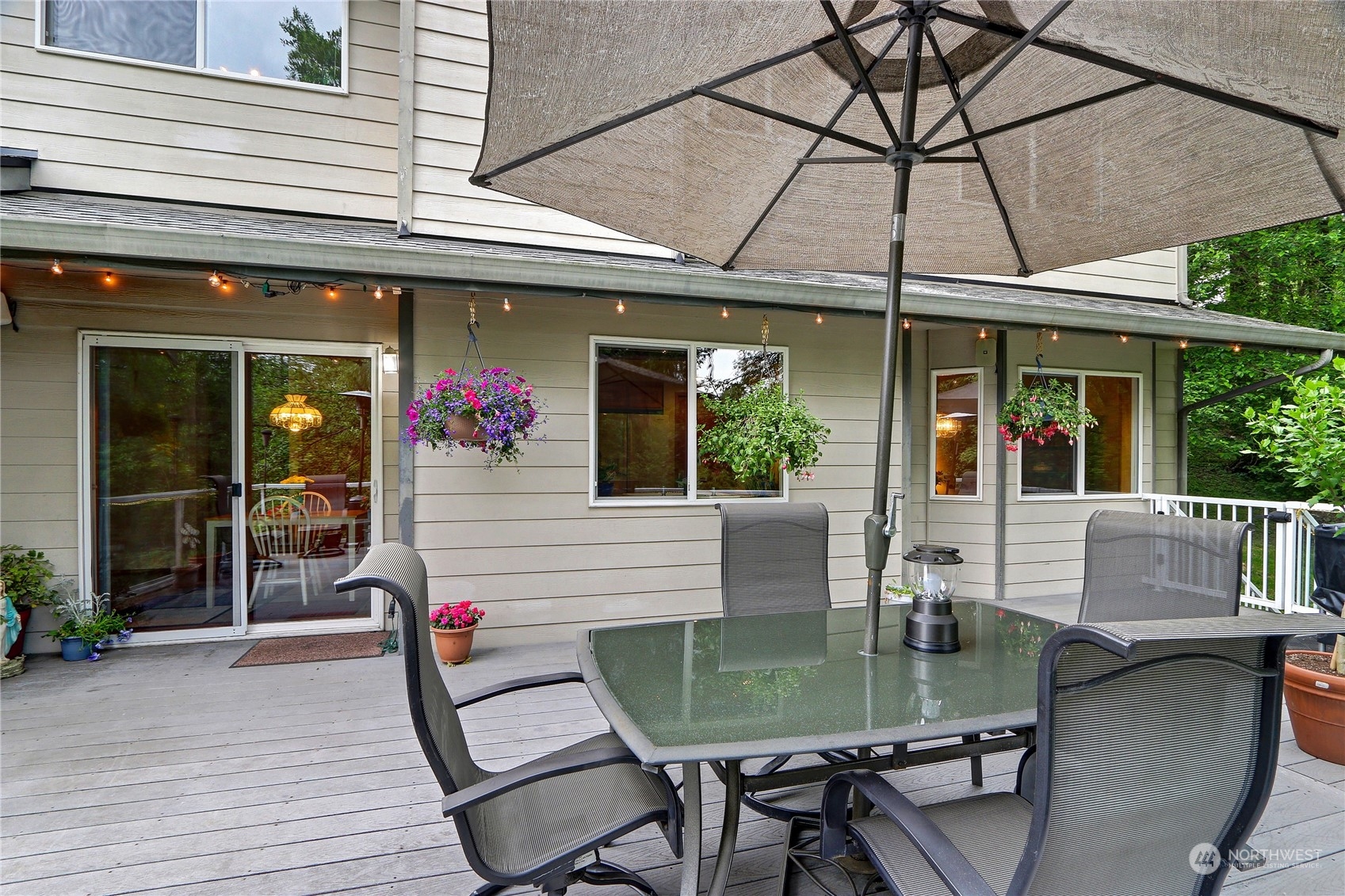 23113 Barker Road Bothell, WA 98021 - Photo 16 of 37 a view of a dinning tables and chairs in patio of the house