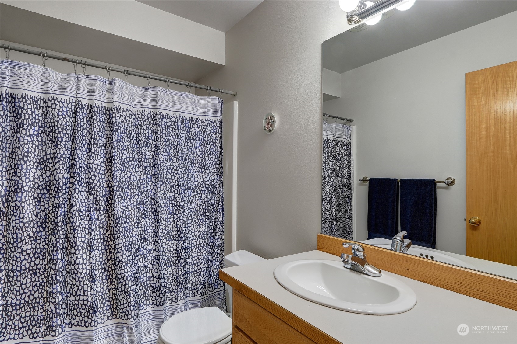 23113 Barker Road Bothell, WA 98021 - Photo 30 of 37 a bathroom with a sink toilet and a mirror