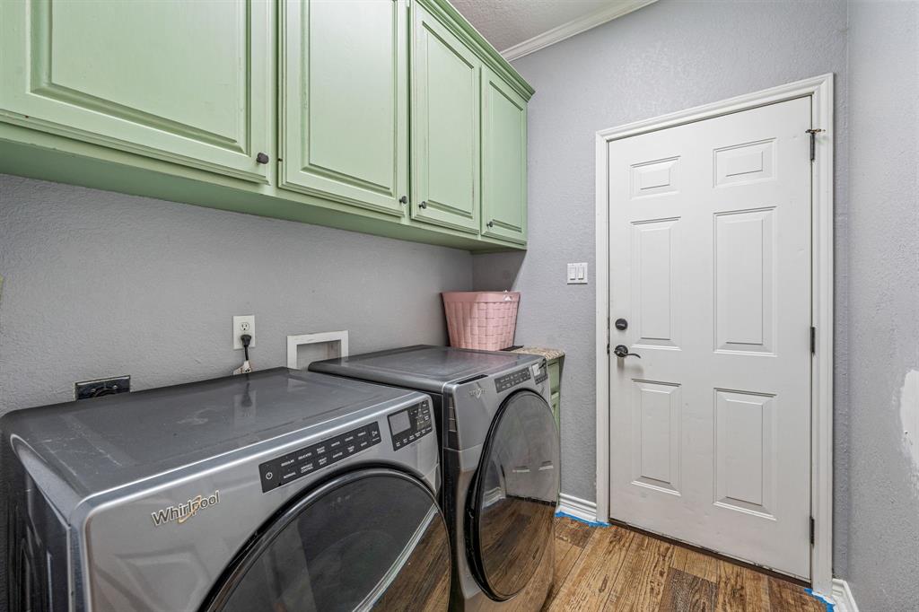 112 Blue Ribbon Lane Stephenville, TX 76401 - Photo 14 of 31 a utility room with dryer and washer