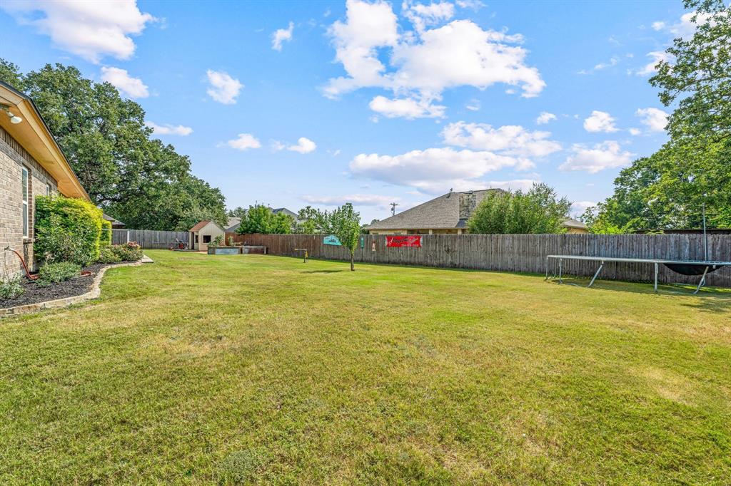 112 Blue Ribbon Lane Stephenville, TX 76401 - Photo 31 of 31 a view of an outdoor space and tennis court