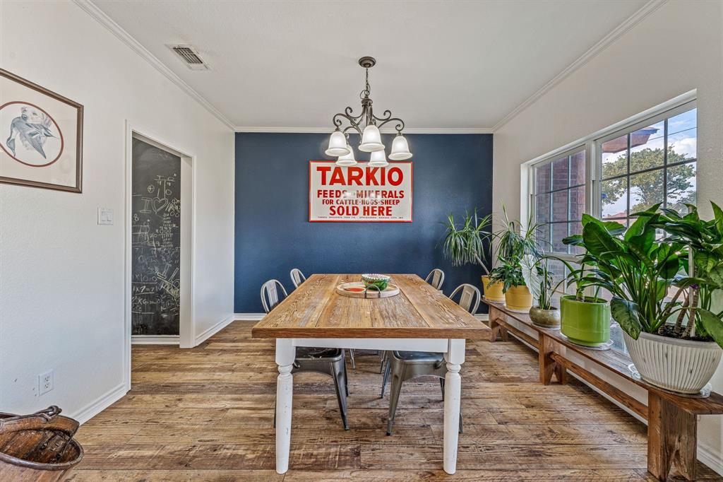 112 Blue Ribbon Lane Stephenville, TX 76401 - Photo 6 of 31 a dinning table with chairs and potted plant