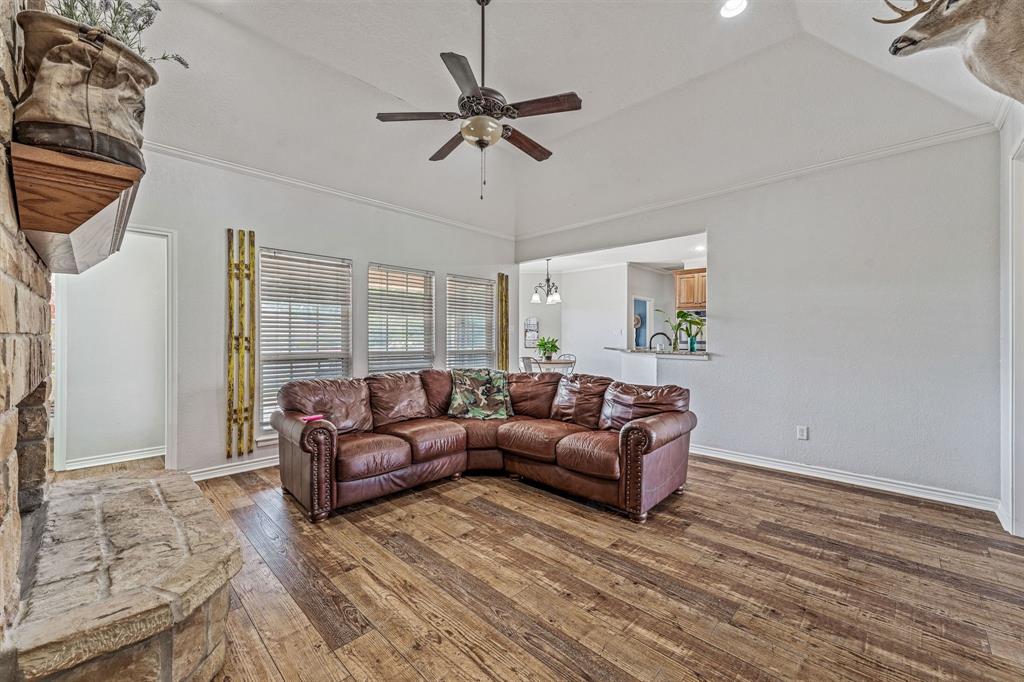112 Blue Ribbon Lane Stephenville, TX 76401 - Photo 9 of 31 a living room with furniture and a window