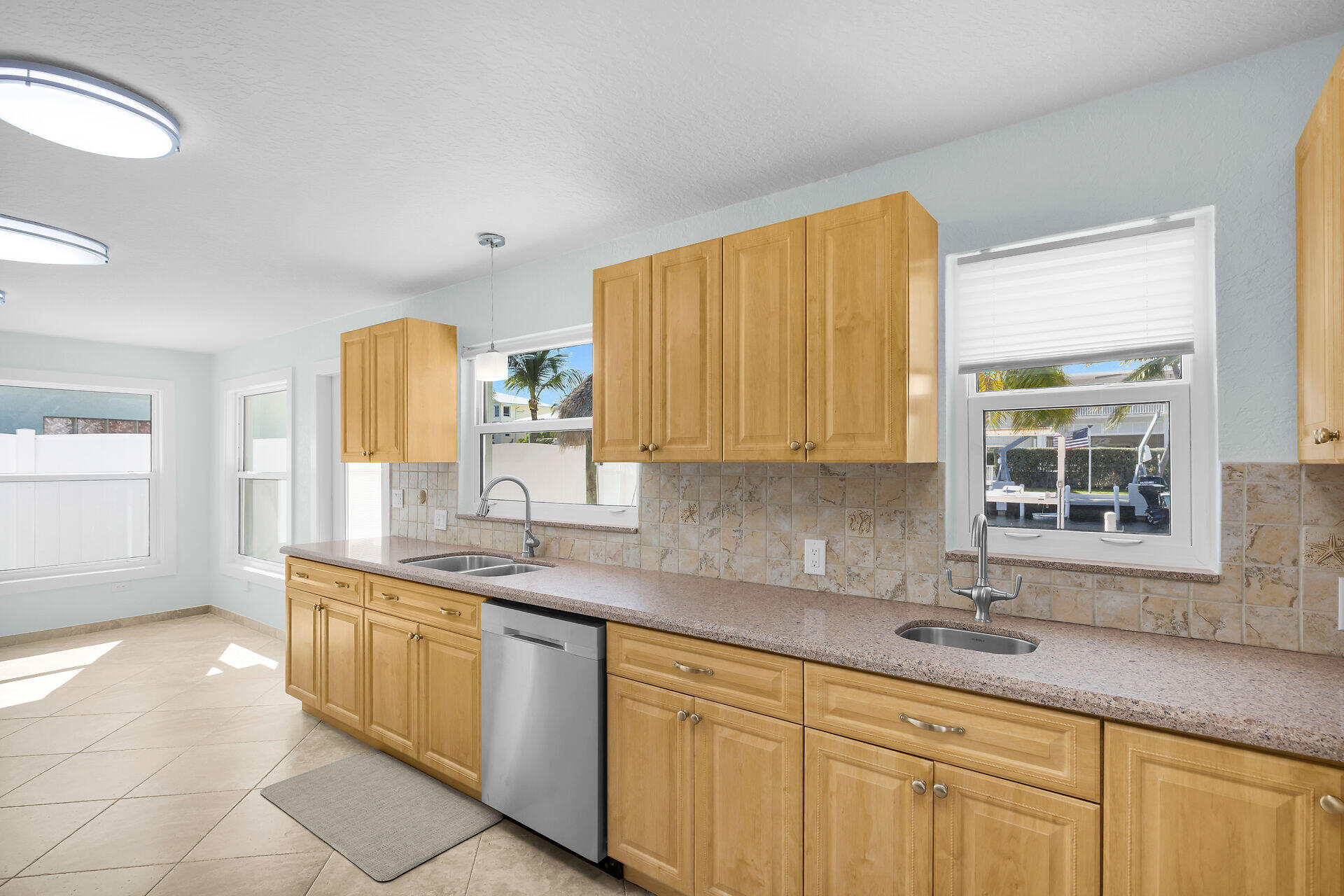 251 Azalea Street Tavernier, FL 33070 - Photo 13 of 58 a kitchen with a sink cabinets and window