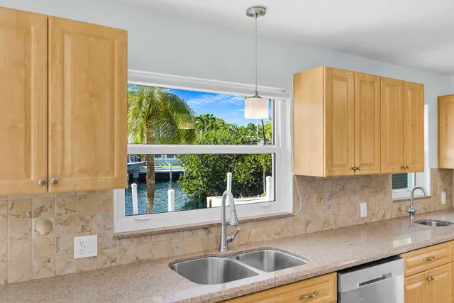 a kitchen with a sink and a window