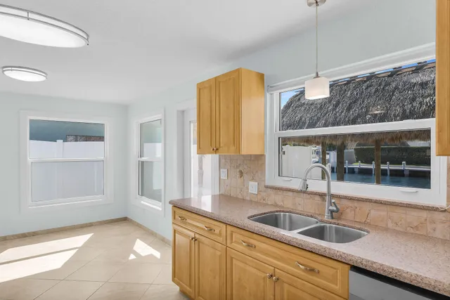 a kitchen with a sink and a window