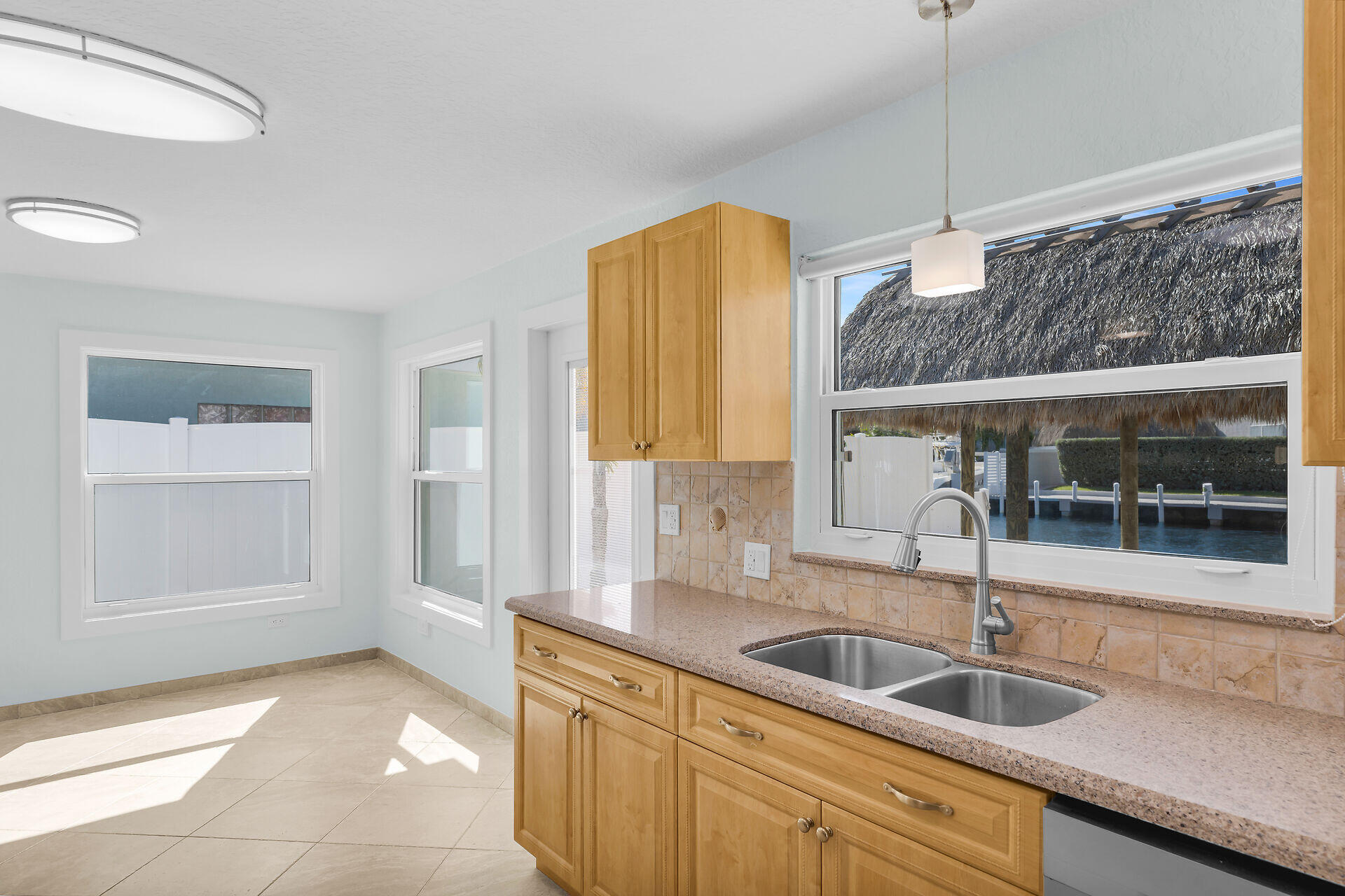 251 Azalea Street Tavernier, FL 33070 - Photo 15 of 58 a kitchen with a sink and a window
